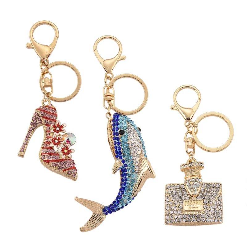 3er-Set emaillierte weiße und mehrfarbige Kristall-Schlüsselanhänger, Pumps, Delfin und Parfümflakon, Legierung in Gelbgold