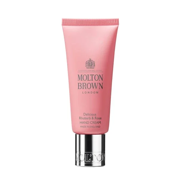 Molton Brown - Delicious Rhubarb & Rose - Hand Cream in rosa Tube mit silbernem Verschluss vor weißem Hintergrund